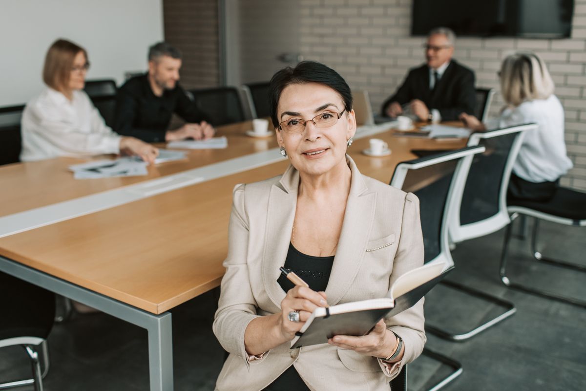 Senior executive woman leading a leadership coaching strategy meeting Senior executive woman leading a leadership coaching strategy meeting